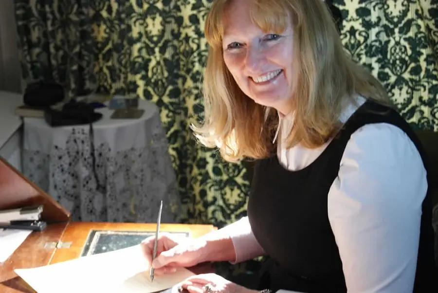 b464b84f-fa80-414e-ab17-520b6a66eac8 Corrine Sankey of Where There's A Will Southport sat at a desk